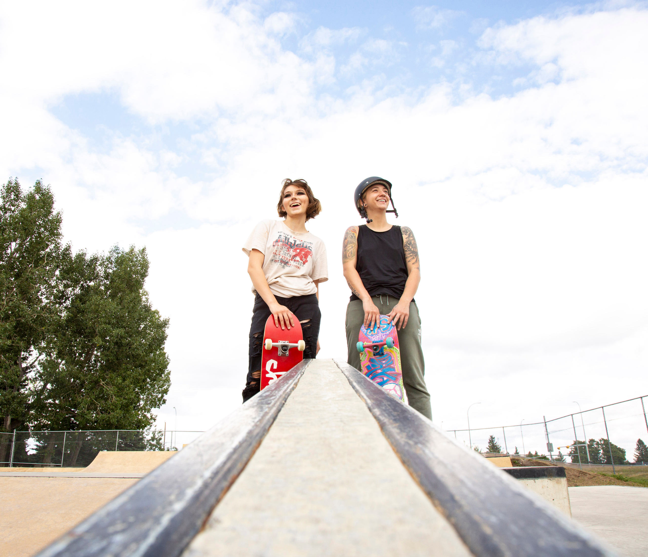 Mentor and mentee skateboarding together